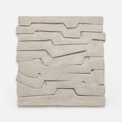 Abstract concrete art with geometric shapes, suitable for outdoor use, featuring light grey concrete material with minor cracks and imperfections.