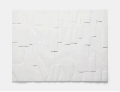 This is a photograph of a piece of wall art resembling a concrete texture with visible cracks and imperfections presented in a