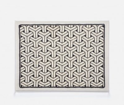 A wall art piece featuring a geometric pattern with a dark background and lighter lines resembling a diamond pattern encased in an