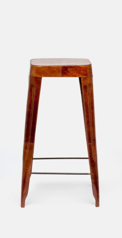 A tall, wooden stool with a leather wrapped frame and contrast stitching, displayed against a white background.