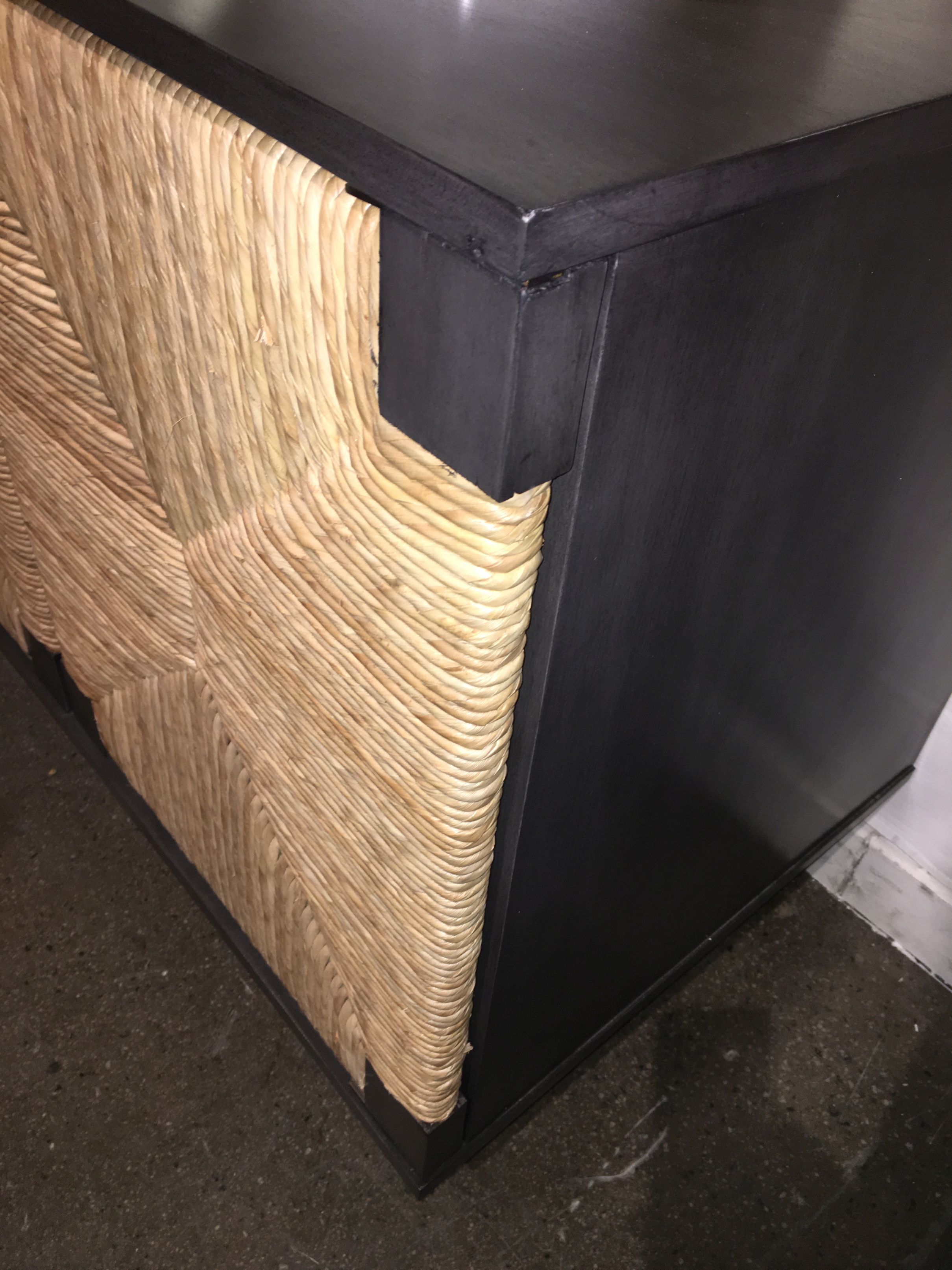 Black and brown wicker sideboard with four doors
