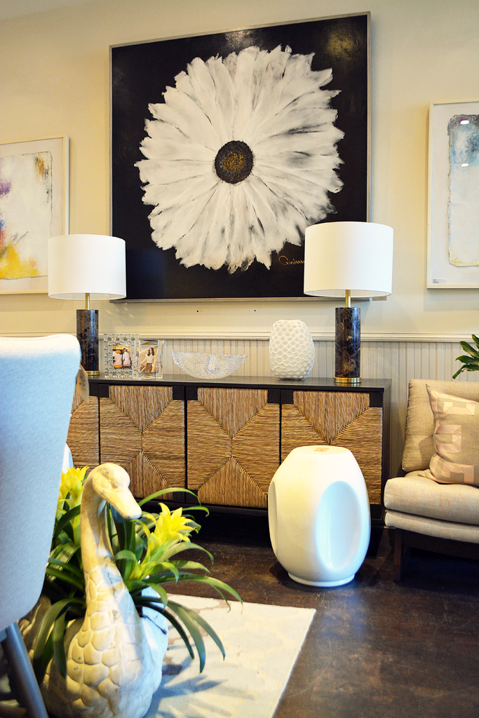 Mahogany Rush Buffet in a living room setting featuring a large decorative painting on the wall and a cozy seating area with