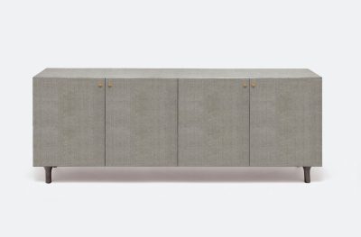 A modern four-door buffet with a textured finish available in off-white or seal faux raffia or grey navy off white or pristine