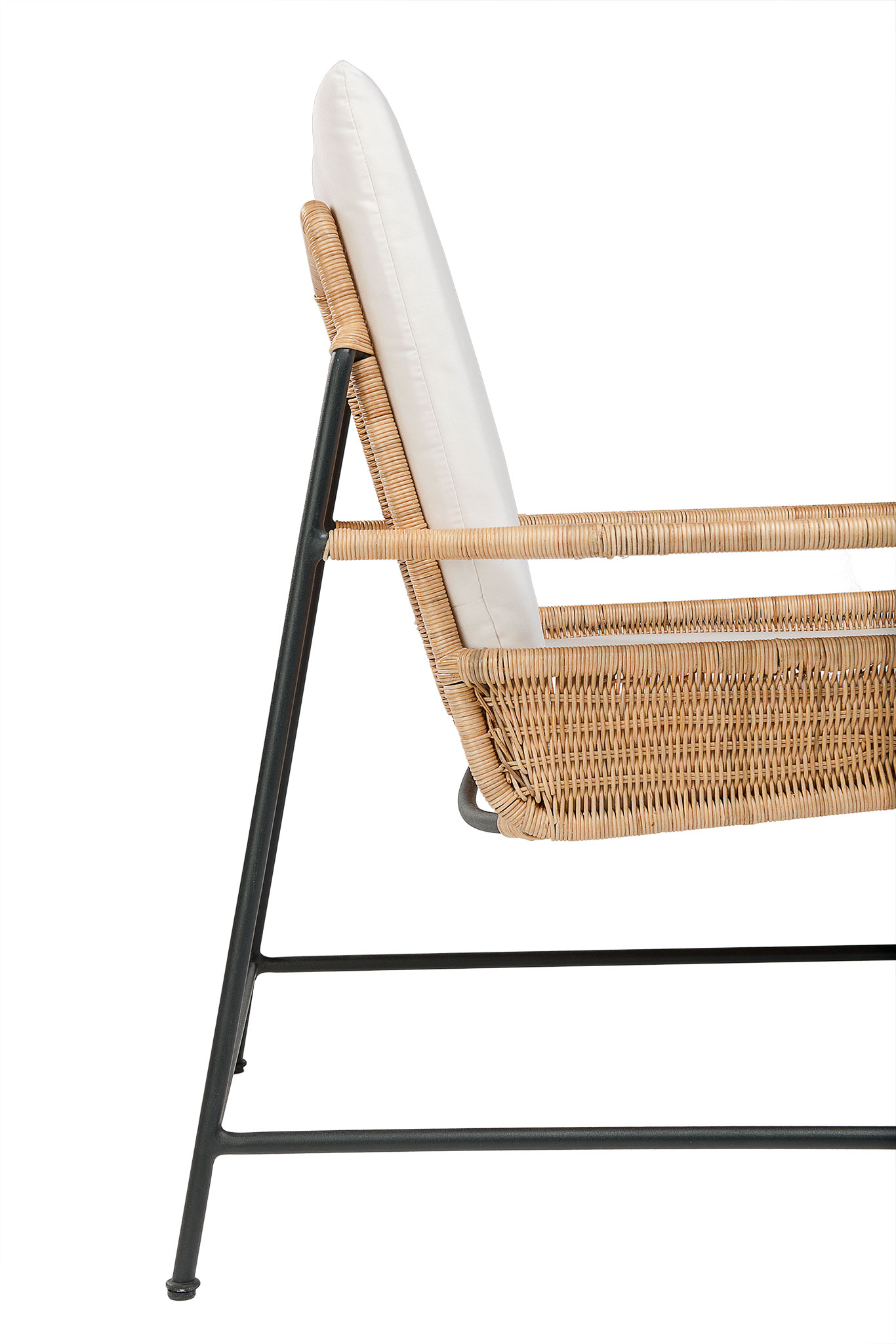 Antibes woven rattan and iron club chair with a canvas seat cushion in natural sunbrella fabric displayed at an angle for full