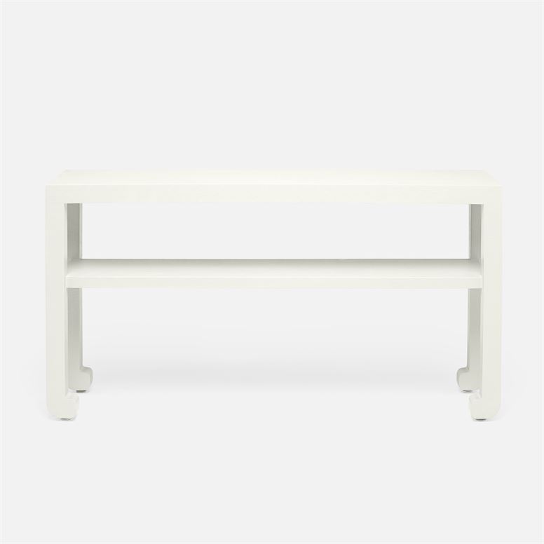 White ming style faux raffia console with a rectangular top and two shelves, against a white background.
