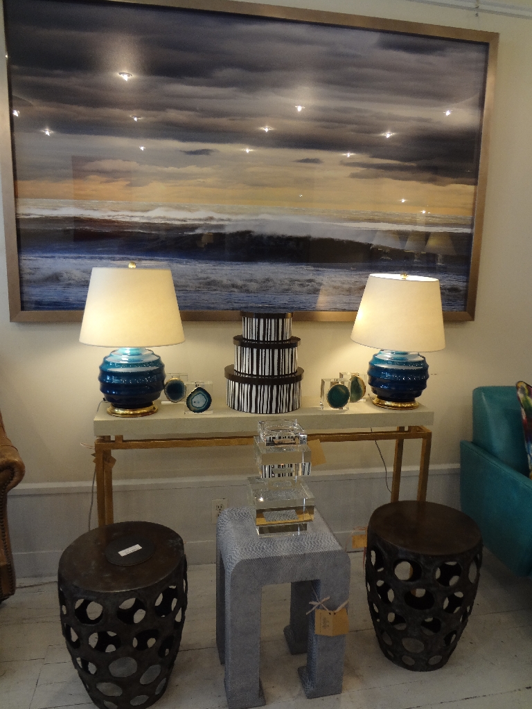 Small console table with a faux shagreen top in a room, displayed on a stand.