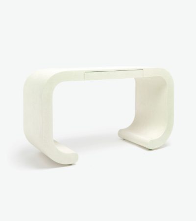 Modern console table with a curved design and a slim drawer, crafted from faux resin raffia material.