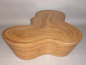 The image displays a pair of wooden coffee tables one with a rattan strip and coco twig veneer covered in resin the
