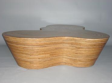 A pair of coffee tables one with a rattan strip and coco twig veneer covered in resin the other with white Both