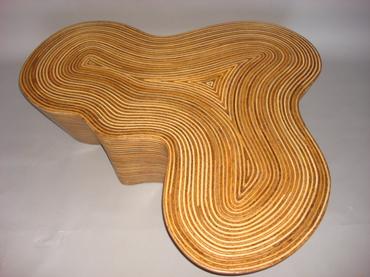 Organic striped wood coffee table with rattan strip and coco twig veneer covered in resin contemporary undulating shape available as a side