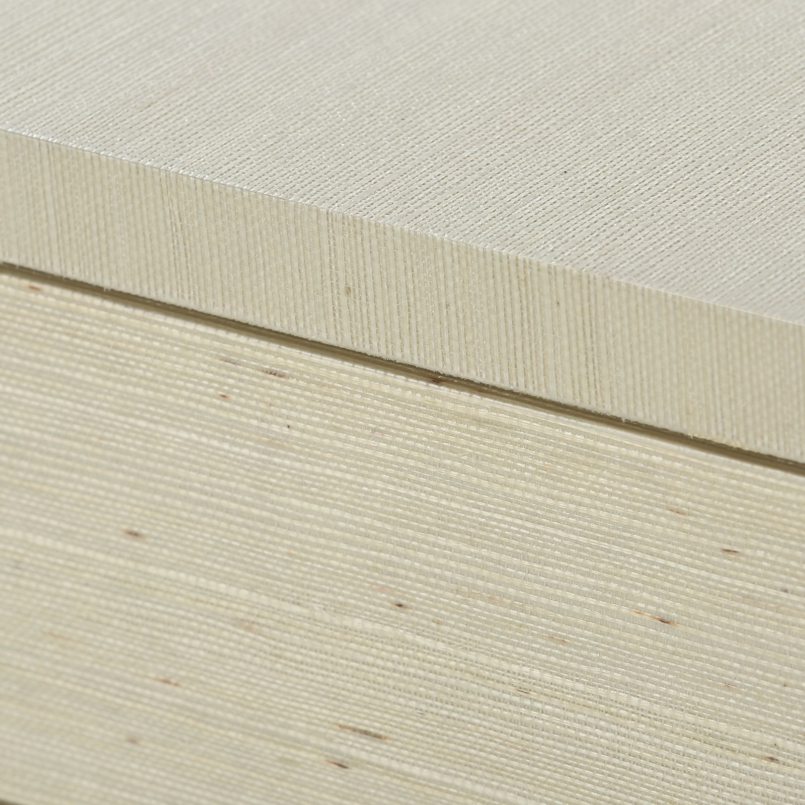 A large, light-colored wooden dresser with a smooth finish and visible grain patterns.