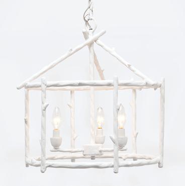 Small white faux bois cage chandelier with three lights.