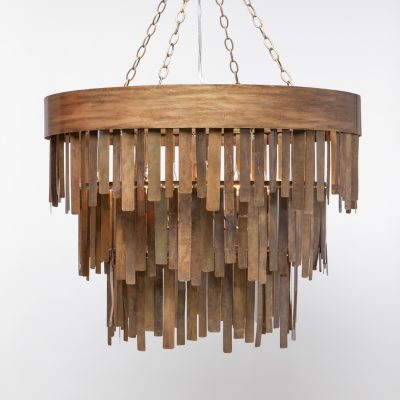 Aged brass chandelier with a metal fringe and five lights, hanging from the ceiling.