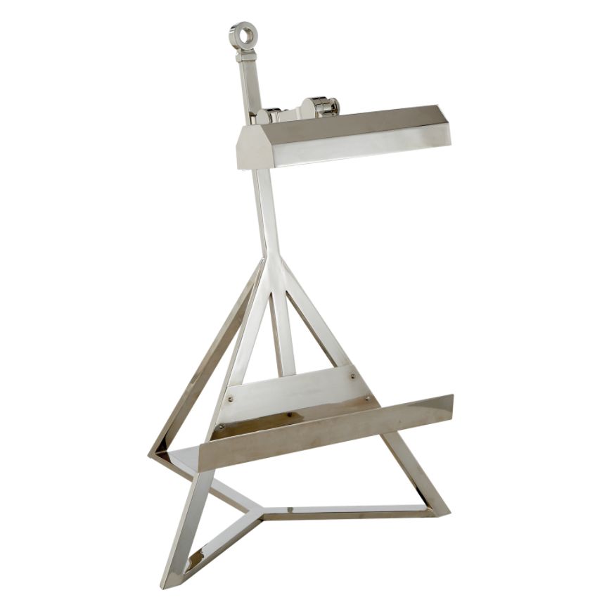 A silver table lamp with a metal stand and a small shade available in natural brass polished nickel or gunmetal finish on