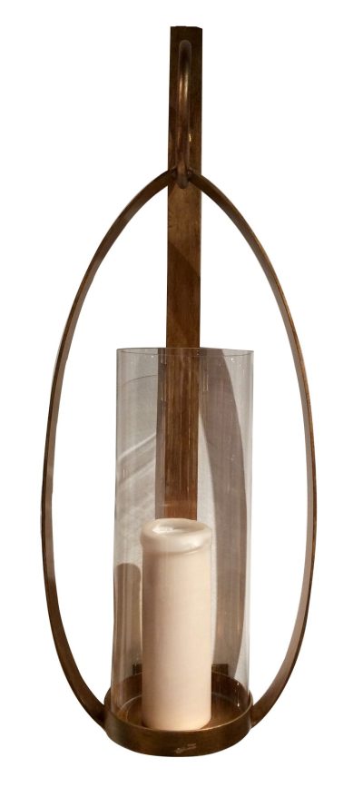 Antiqued gold loop wall sconce with candle holder, featuring a circular design and a candle in the center.