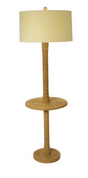 A tall floor lamp with a woven rope base and a round 18-inch diameter linen shade The lamp is placed on a