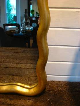 Antique gold leaf scalloped rectangle mirror with undulating moulding, reminiscent of Art Nouveau design from late 19th century Paris.