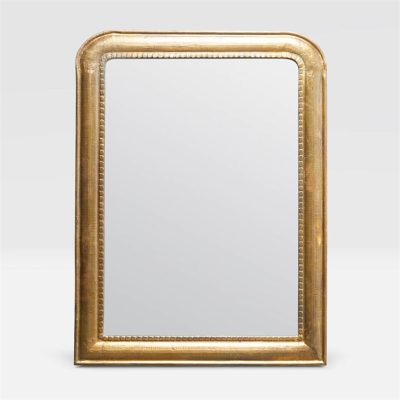Gold framed mirror with a curved top and faux nailhead trim, set against a white background.