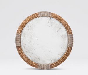 The image displays a round mirror with a faux rope frame and an antiqued center, set against a white background.