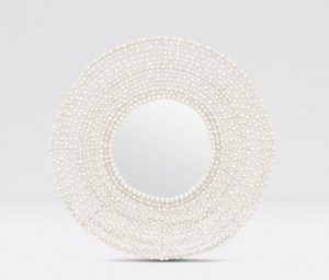 White and bronze round wood beaded mirror on a white background.