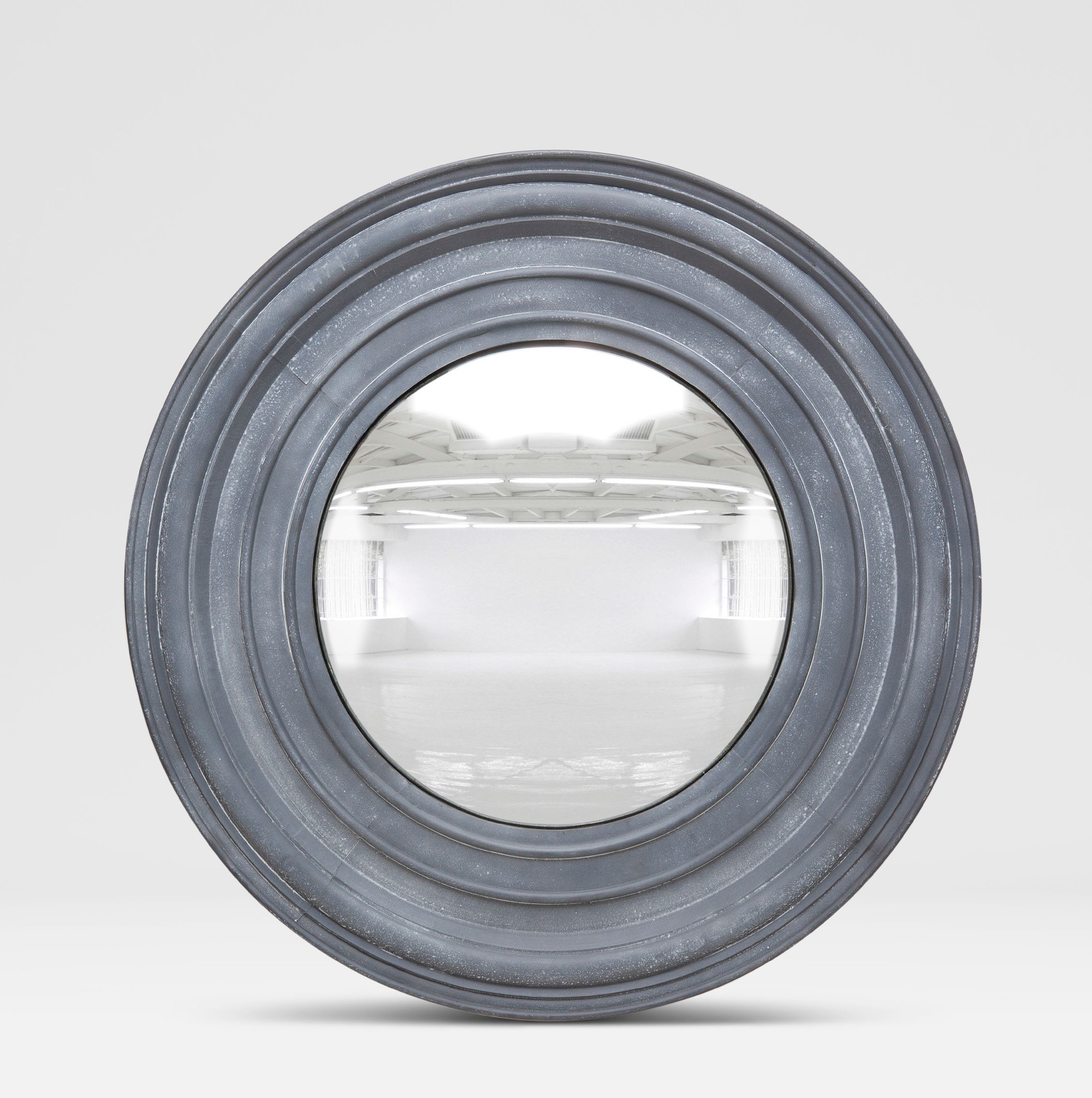 Round mirror with a blue frame and concentric circles, showcasing its design and shape.