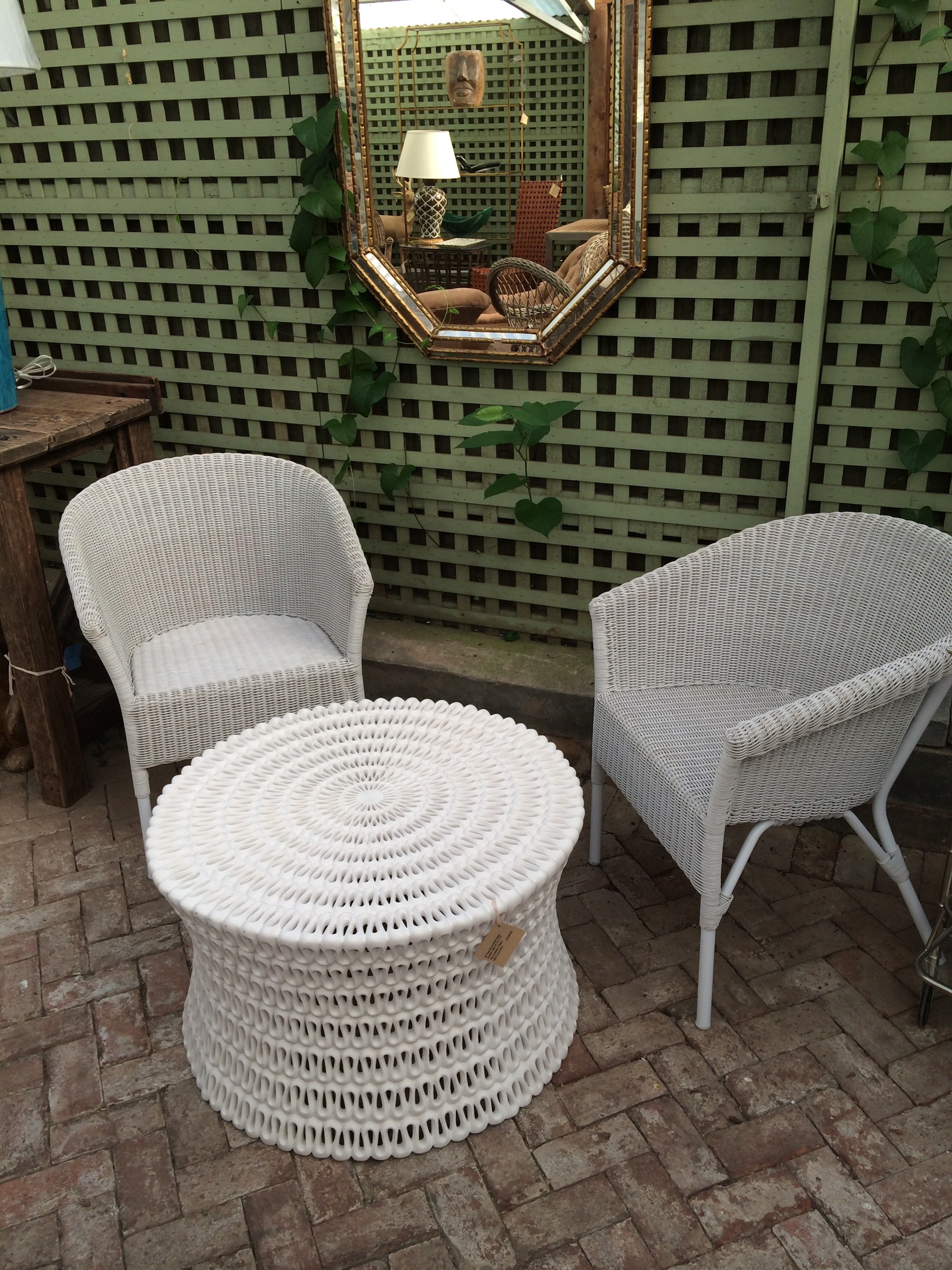 White wicker armchair on patio
