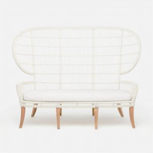 An outdoor sofa with a wicker frame and teak legs, featuring a white cushion and available in various color options.