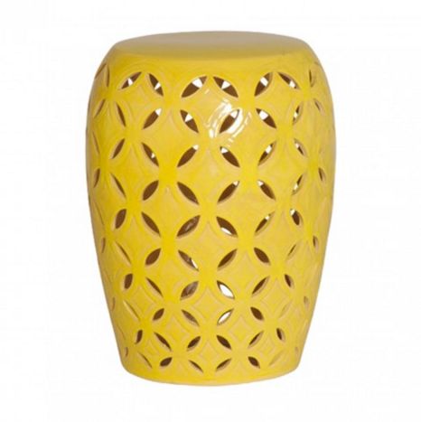A small, handcrafted stool with a yellow glazed crackle pattern and lattice design.