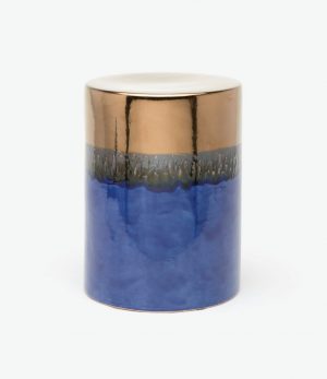 Round ceramic stool with a crackled gold top and blue base.