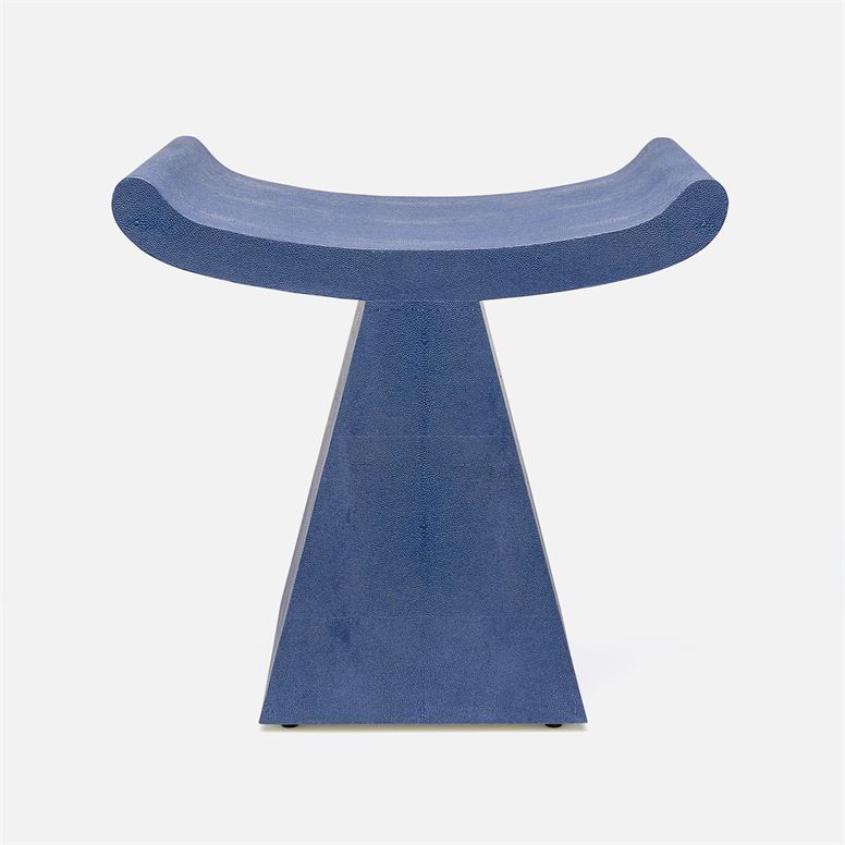 A blue faux shagreen stool with a modern art deco design and a unique triangular shape.