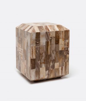 A square stool made of dark and light mixed petrified wood, showcasing a unique geometric pattern.
