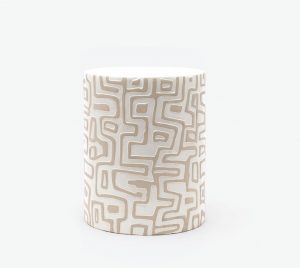 The image showcases a ceramic stool with a graphic print design featuring a raised pattern contrast glazed top It is available in