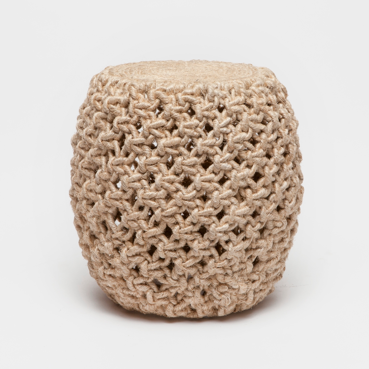 A woven, beige rope stool with a cylindrical shape and a knitted texture.