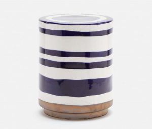 A ceramic stool with blue and white stripes, standing upright against a neutral background.