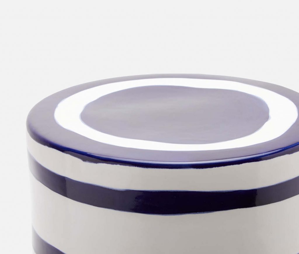 Blue and white striped ceramic stool with metallic glazed bottom