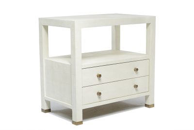 White nightstand with brass handles and a faux shagreen finish, presented in a side view.