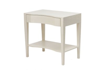 White nightstand with curved front and single drawer, set against a white background.