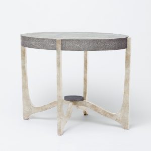 A modern minimalist side table with a unique design featuring a combination of marble-like texture and geometric shapes The tabletop is adorned