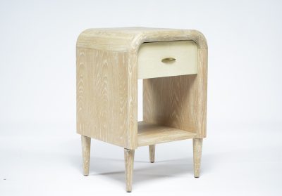 Small wooden nightstand with a single drawer and bottom shelf, featuring a faux shagreen finish on the top surface and tapered legs.