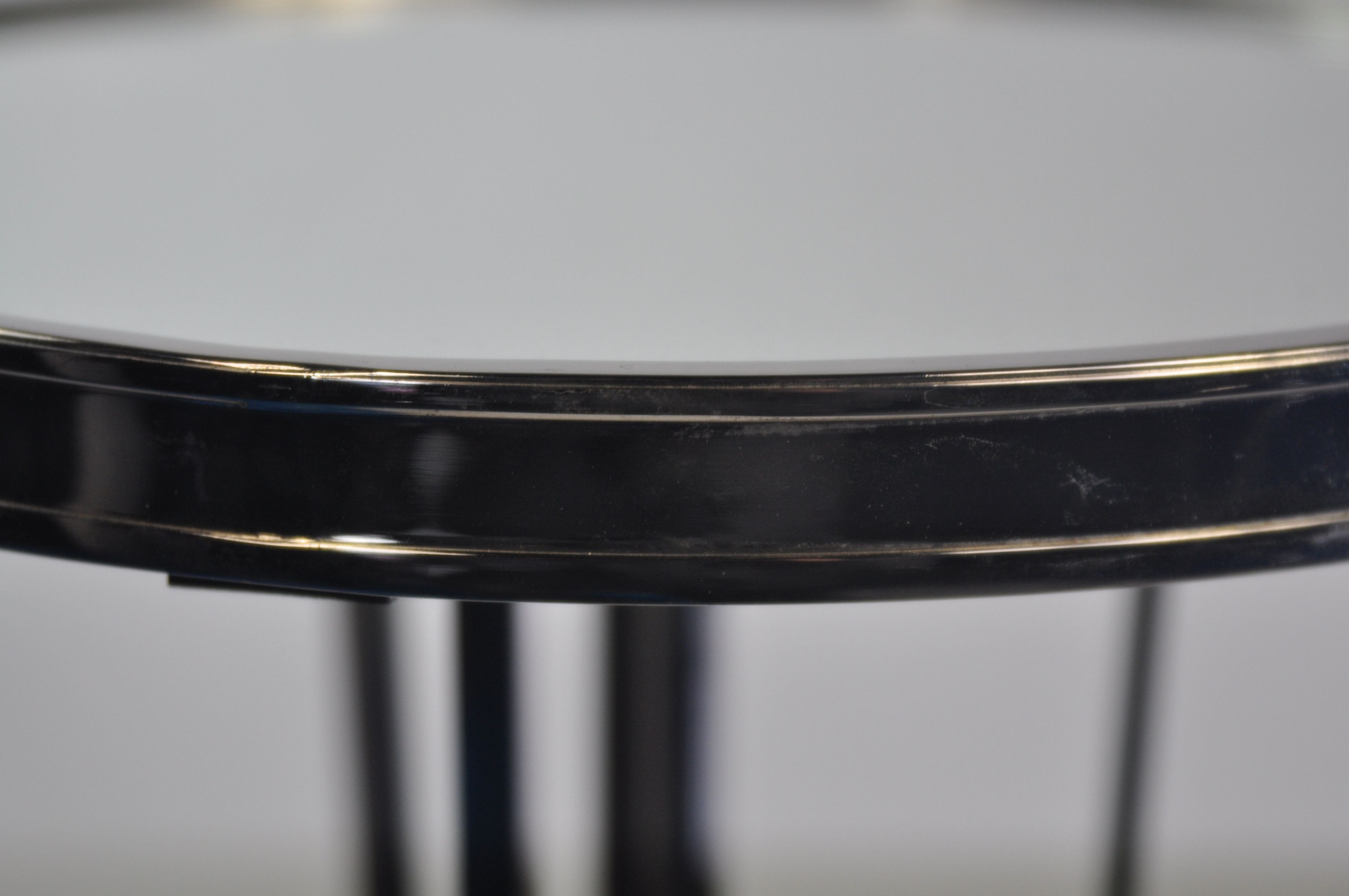 French modern side table with a nickel finish and a mirrored top.