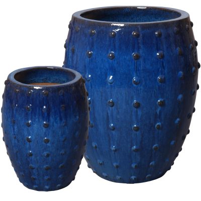 Three blue planters with a studded design, two larger and one smaller, displayed against a white background.