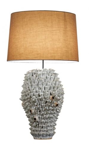 White Barnacle Ceramic Lamp with a beige shade and a white base featuring a unique design resembling a coral or shell against
